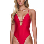 Woman wearing a red swimsuit on a white background