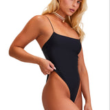 Woman wearing a black swimsuit on a white background