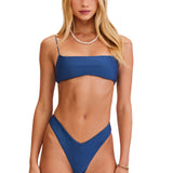 Woman wearing a blue bikini set on a white background