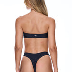 Woman wearing a black bikini on a white background